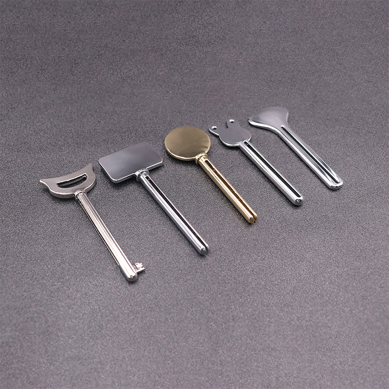 Kovový dávkovač zubnej pasty Čistiaci prostriedok na tvár Zubná pasta stláčač tuby Key Shape Kozmetika