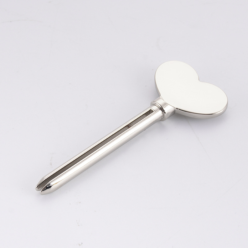 Kovový dávkovač zubnej pasty Čistiaci prostriedok na tvár Zubná pasta stláčač tuby Key Shape Kozmetika