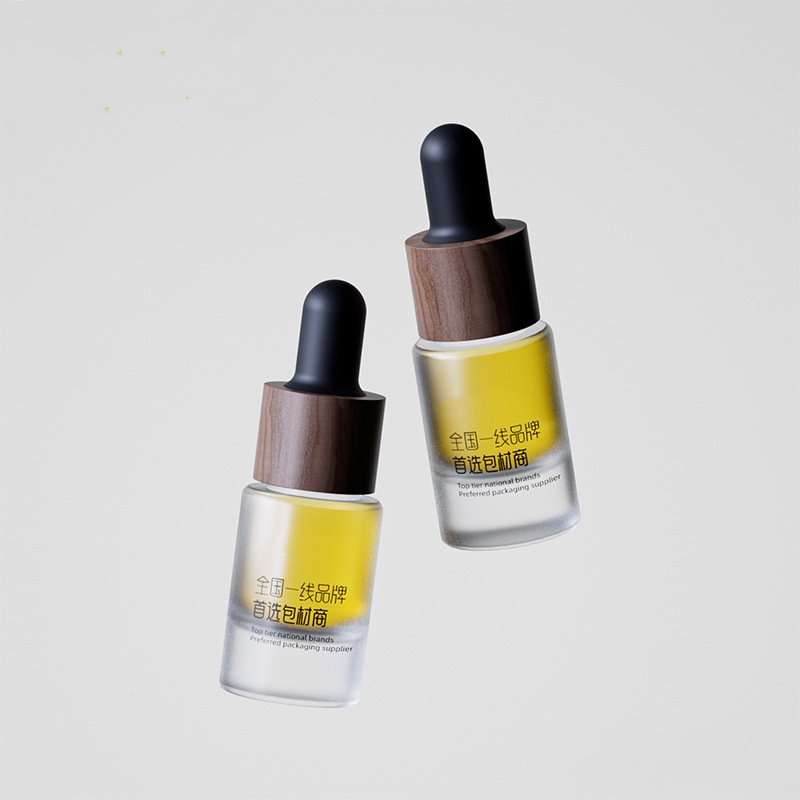 Malé sklenené fľaštičky na esenciálny olej s kovovými alebo drevenými kvapkadlami Malé sklenené fľaštičky na esenciálny olej s kovovými alebo drevenými kvapkadlami